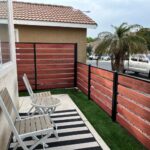 Composite Fence-redwood and steel